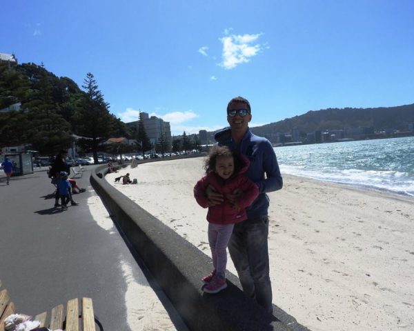 Lara and Dad at the beach in Wellington