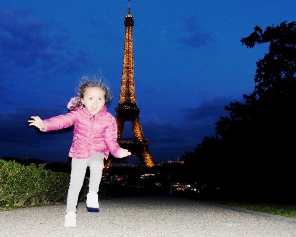 Lara and the Eiffel Tower by night