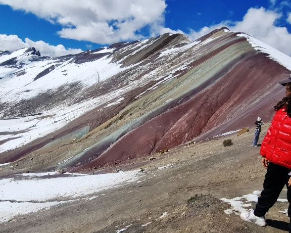 Lara at the top of the Rainbow Mountain